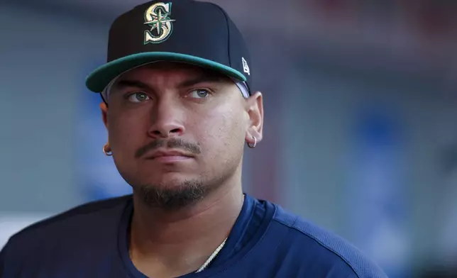 Seattle Mariners first baseman Josh Naylor stands in the dugout during the second inning of a baseball game against the Los Angeles Angels, Friday, July 25, 2025, in Anaheim, Calif. (AP Photo/Eric Thayer)