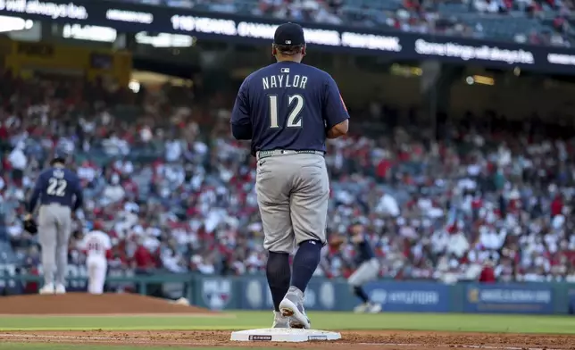 Seattle Mariners first baseman Josh Naylor stands on the field during the second inning of a baseball game against the Los Angeles Angels, Friday, July 25, 2025, in Anaheim, Calif. (AP Photo/Eric Thayer)