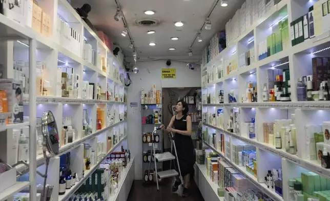Sales team leader Jay Liang works at a Senti Senti store in New York on Friday, July 25, 2025. (AP Photo/Yuki Iwamura)