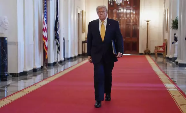 President Donald Trump arriving before speaking at a ceremony to sign the "Halt All Lethal Trafficking of Fentanyl Act," in the East Room of the White House, Wednesday, July 16, 2025, in Washington. (AP Photo/Evan Vucci)