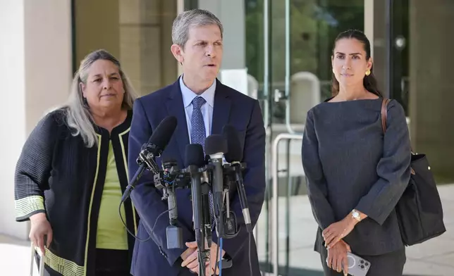 David Oscar Markus, attorney for Ghislaine Maxwell, center, speaks during a news conference outside the federal courthouse in Tallahassee, Fla., Thursday, July 24, 2025. Behind him is Leah Saffian, co-attorney, left, and Mellissa Madrigal, right. (AP Photo/John Raoux)