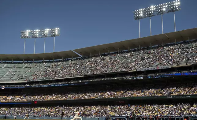Los Angeles Dodgers starting pitcher Shohei Ohtani delivers during the first inning of a baseball game against the Houston Astros in Los Angeles, Saturday, July 5, 2025. (AP Photo/Kyusung Gong)