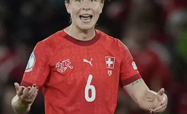 Switzerland's Geraldine Reuteler celebrates after scoring the opening goal during the Euro 2025, group A, soccer match between Switzerland and Iceland at Stadion Wankdorf in Bern, Switzerland, Sunday, July 6, 2025. (AP Photo/Martin Meissner)