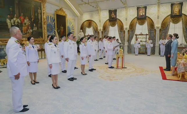 In this photo released by Bureau of the Royal Household, Thailand's Acting Prime Minister Suriya Jungrungreangkit and his cabinet members to take their oath in front of Thailand's King Maha Vajiralongkorn and Queen Suthida at Ampornsan Throne Hall in Bangkok Thursday, July 3, 2025. (Bureau of the Royal Household via AP)