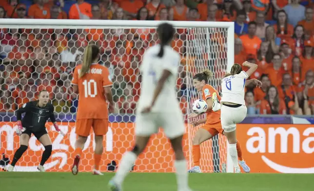 France's Sandie Toletti, right, scores the opening goal during the Women's Euro 2025, group D, soccer match between the Netherlands and France at St. Jakob-Park in Basel, Switzerland, Sunday, July 13, 2025. (AP Photo/Alessandra Tarantino)