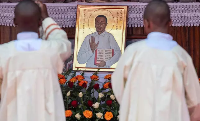 Catholic priests attend Mass to celebrate the life of late Floribert Bwana Chui Bin Kositi, at a catholic church in Goma, Democratic Republic of Congo, Tuesday July 8, 2025. (AP Photo/Moses Sawasawa)