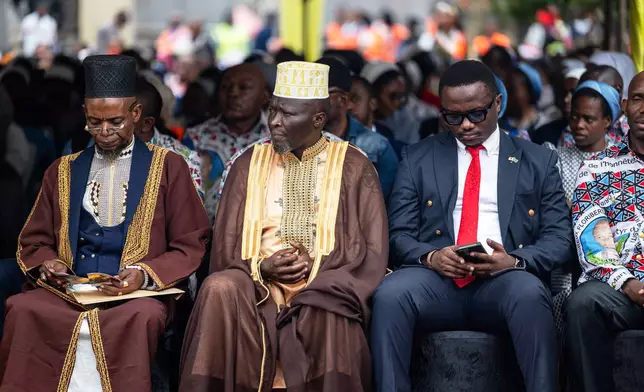 People attend Mass to celebrate the life of late Floribert Bwana Chui Bin Kositi, at a catholic church in Goma, Democratic Republic of Congo, Tuesday July 8, 2025. (AP Photo/Moses Sawasawa)