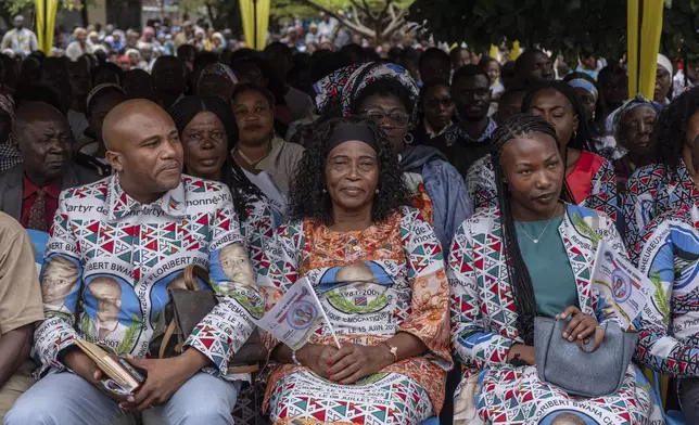 People attend Mass to celebrate the life of late Floribert Bwana Chui Bin Kositi, at a catholic church in Goma, Democratic Republic of Congo, Tuesday July 8, 2025. (AP Photo/Moses Sawasawa)