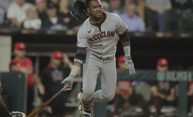 Cleveland Guardians' Angel Martínez watches his hit during the seventh inning in the second baseball game of a doubleheader against the Chicago White Sox, Friday, July 11, 2025, in Chicago. (AP Photo/Melissa Tamez)