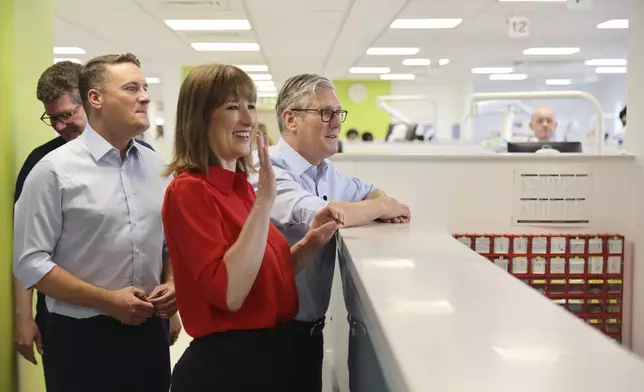 Britain's Prime Minister Keir Starmer, right, Chancellor Rachel Reeves and Health Secretary Wes Streeting during a visit to the Sir Ludwig Guttman Health &amp; Wellbeing Centre in east London, Thursday, July 3, 2025. (Jack Hill/Pool Photo via AP