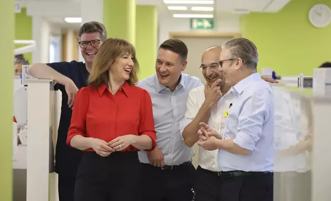 Britain's Prime Minister Keir Starmer, right, Chancellor Rachel Reeves and Health Secretary Wes Streeting during a visit to the Sir Ludwig Guttman Health &amp; Wellbeing Centre in east London, Thursday, July 3, 2025. (Jack Hill/Pool Photo via AP)