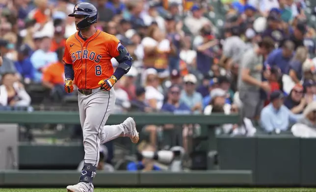 Houston Astros' Christian Walker jogs home after hitting a solo home run against the Seattle Mariners during the sixth inning of a baseball game Sunday, July 20, 2025, in Seattle. (AP Photo/Lindsey Wasson)