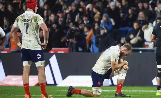 Jacobus Van Tonder of France and teammate Killian Tixeront, left, react following of their rugby test against New Zealand in Dunedin, New Zealand, Saturday, July 5, 2025. (Marty Melville/Photosport via AP)