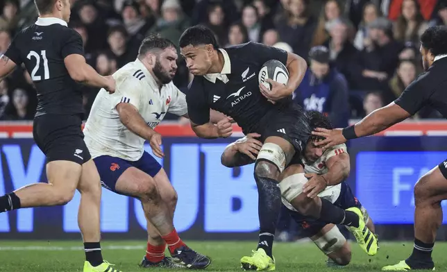Tupou Vaa'i of New Zealand run sat the defence during their rugby test against France in Dunedin, New Zealand, Saturday, July 5, 2025. (Marty Melville/Photosport via AP)