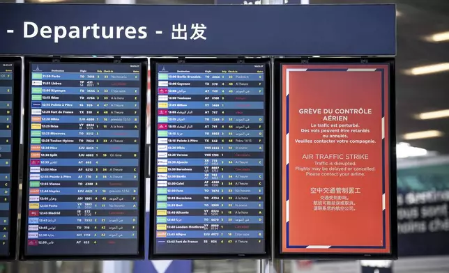 A departures information board is seen at Orly airport, near Paris, as French air traffic controllers launched a two-day strike to demand better working conditions, Friday, July 4, 2025. (AP Photo/Aurelien Morissard)