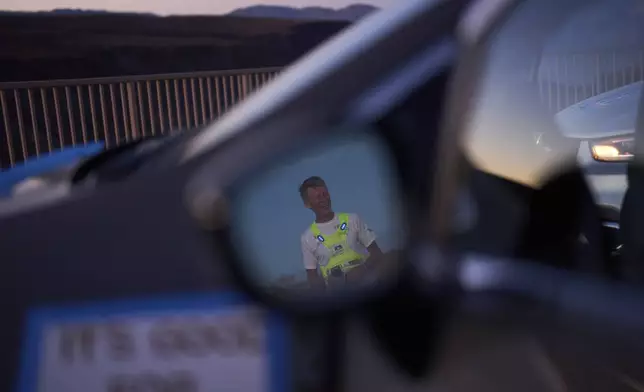 Danny Westergaard reacts while taking a break around the 24-hour mark during the Badwater 135 Ultramarathon, Tuesday, July 8, 2025, in Death Valley National Park, Calif. (AP Photo/John Locher)
