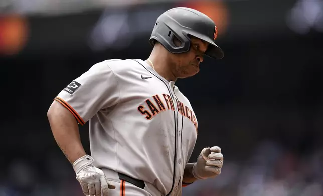 San Francisco Giants designated hitter Rafael Devers (16) rounds the bases after hitting a three-run home run against the Atlanta Braves in the sixth inning of a baseball game, Wednesday, July 23, 2025, in Atlanta. (AP Photo/Mike Stewart)