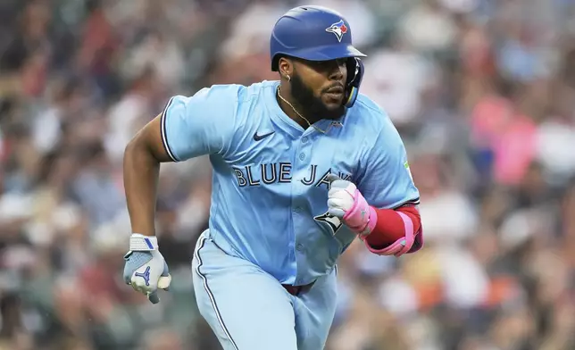 Toronto Blue Jays' Vladimir Guerrero Jr. runs after hitting a double to score Nathan Lukes during the fifth inning of a baseball game against the Detroit Tigers Friday, July 25, 2025, in Detroit. (AP Photo/Ryan Sun)