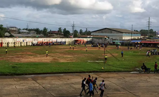 Teams in Liberia's professional kickball league play a match at the Samuel Kanyon Doe Stadium in Monrovia, Liberia, June 14, 2025. (AP Photo/Annie Risemberg)