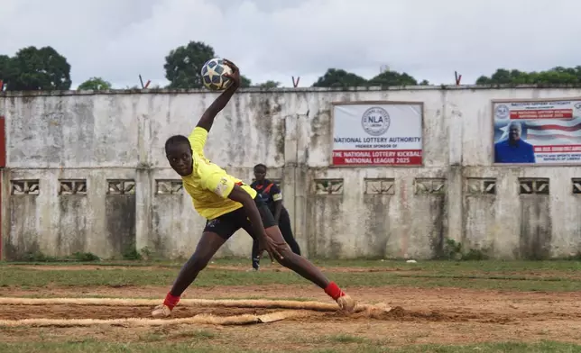 A kickball pitcher winds up before throwing a ball during a match at the Samuel Kanyon Doe Stadium in Monrovia, Liberia, June 14, 2025. (AP Photo/Annie Risemberg)