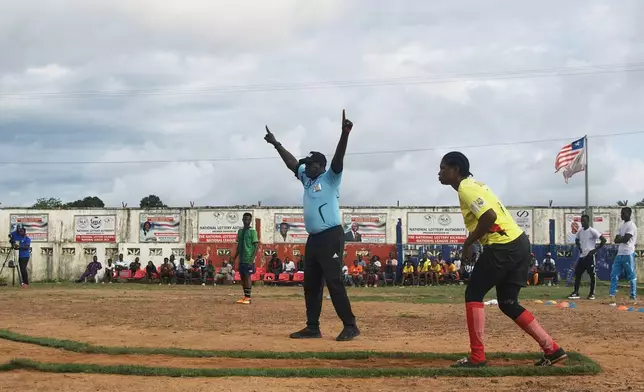 A kickball player prepares to kick the ball during a match at the Samuel Kanyon Doe Stadium in Monrovia, Liberia, June 14, 2025. (AP Photo/Annie Risemberg)