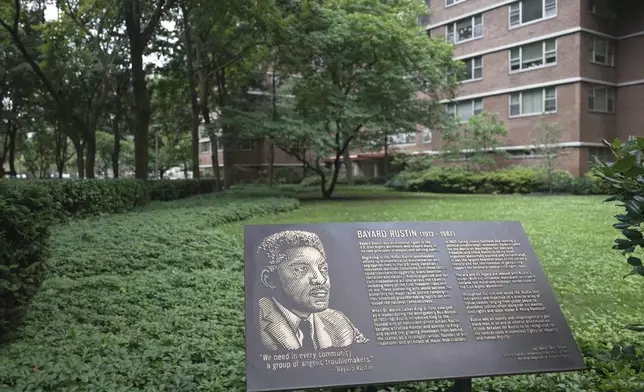 In this still image taken from video, a plaque honoring Bayard Rustin is pictured outside of partner Walter Naegle's home on Saturday, June 28, 2025, in New York. (AP Photo/Mary Conlon)