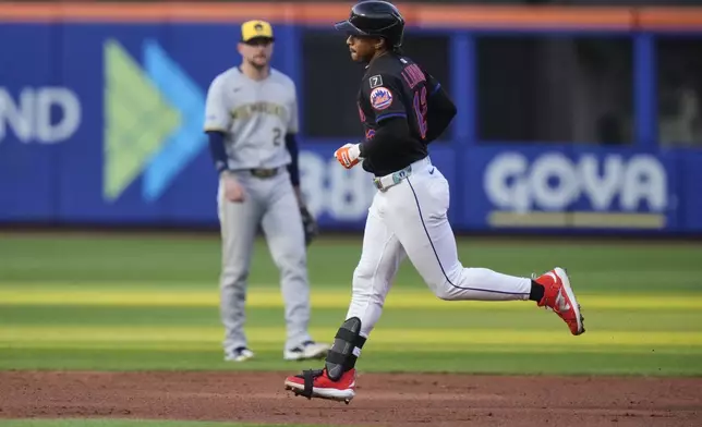 New York Mets' Francisco Lindor (12) runs the bases after hitting a home run during the second inning in the second baseball game of a doubleheader against the Milwaukee Brewers Wednesday, July 2, 2025, in New York. (AP Photo/Frank Franklin II)