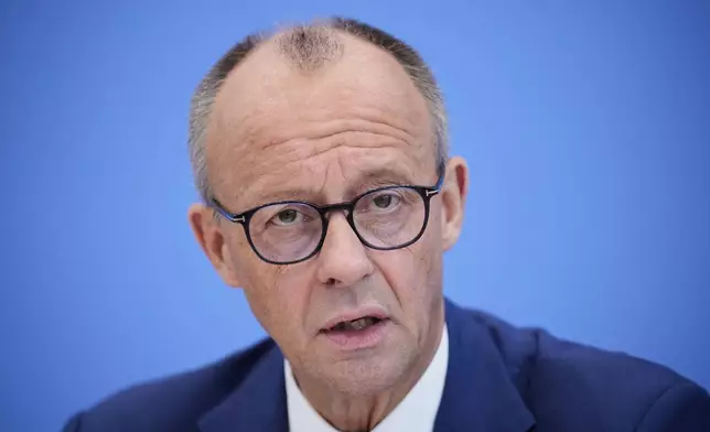 German Chancellor Friedrich Merz attends the annual press conference at the Federal Press Conference in Berlin, Germany, Friday, July 18, 2025. (AP Photo/Ebrahim Noroozi)