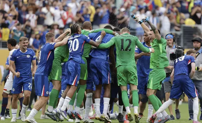 Chelsea's players celebrate after winning the Club World Cup final soccer match against PSG in East Rutherford, N.J., Sunday, July 13, 2025. (AP Photo/Adam Hunger)