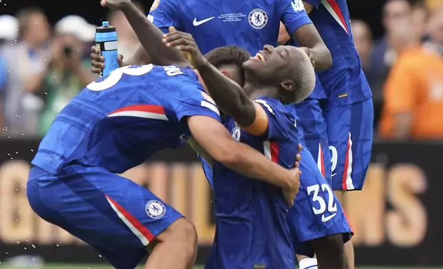 Chelsea players celebrate after winning the Club World Cup final soccer match against Paris Saint-Germain in East Rutherford, N.J., Sunday, July 13, 2025. (AP Photo/Frank Franklin II)