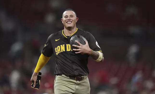 San Diego Padres' Manny Machado smiles during a pitching change in the sixth inning of a baseball game against the St. Louis Cardinals Thursday, July 24, 2025, in St. Louis. (AP Photo/Jeff Roberson)
