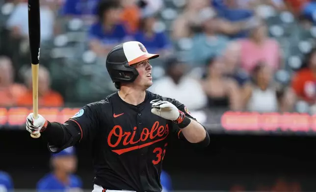 Baltimore Orioles' Adley Rutschman watches his two-run RBI double during the third inning of a baseball game against the Toronto Blue Jays, Monday, July 28, 2025, in Baltimore. (AP Photo/Stephanie Scarbrough)
