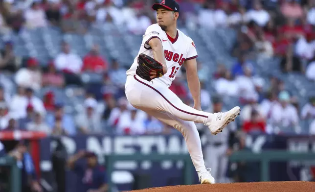 Los Angeles Angels pitcher Yusei Kikuchi prepares to throw to a Arizona Diamondbacks batter during the first inning of a baseball game in Anaheim, Calif., Saturday, July 12, 2025. (AP Photo/Jessie Alcheh)