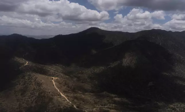 An aerial view shows mountainous terrain near Nogales, Ariz., Tuesday, July 22, 2025. (AP Photo/Jae C. Hong)