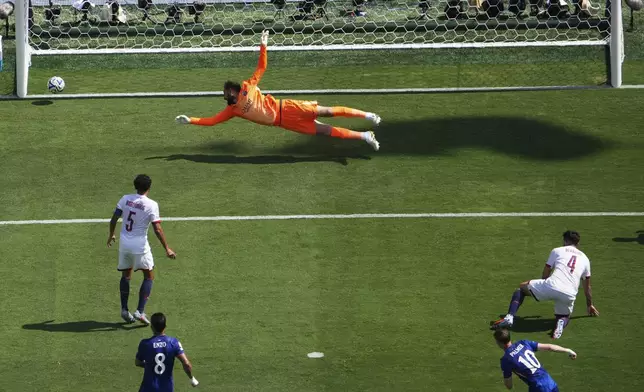 Chelsea's Cole Palmer (10) scores his team's second goal past Paris Saint-Germain's goalkeeper Gianluigi Donnarumma (1) during the Club World Cup final soccer match between Chelsea and PSG in East Rutherford, N.J., Sunday, July 13, 2025. (AP Photo/Matt Slocum)