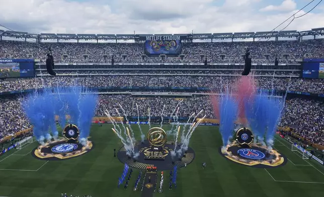 Players stand line before starting the Club World Cup final soccer match between Chelsea and PSG in East Rutherford, N.J., Sunday, July 13, 2025. (AP Photo/Pamela Smith)