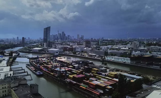 Containers are piled up at a cargo terminal in Frankfurt, Germany, Monday, July 14, 2025. (AP Photo/Michael Probst)