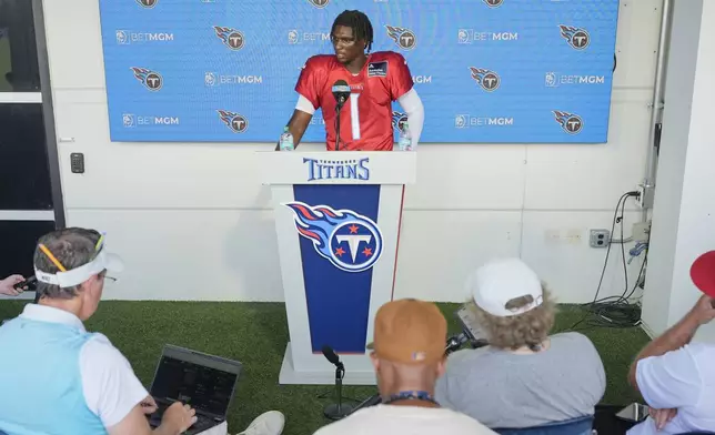 Tennessee Titans quarterback Cam Ward speaks during a news conference after practice at the team's NFL football training camp Wednesday, July 30, 2025, in Nashville, Tenn. (AP Photo/George Walker IV)