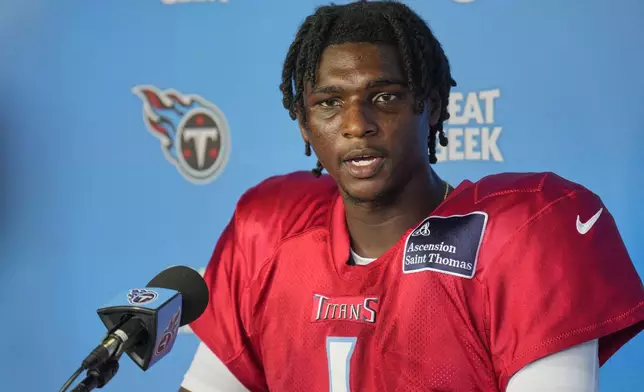 Tennessee Titans quarterback Cam Ward speaks during a news conference after practice at the team's NFL football training camp Wednesday, July 30, 2025, in Nashville, Tenn. (AP Photo/George Walker IV)