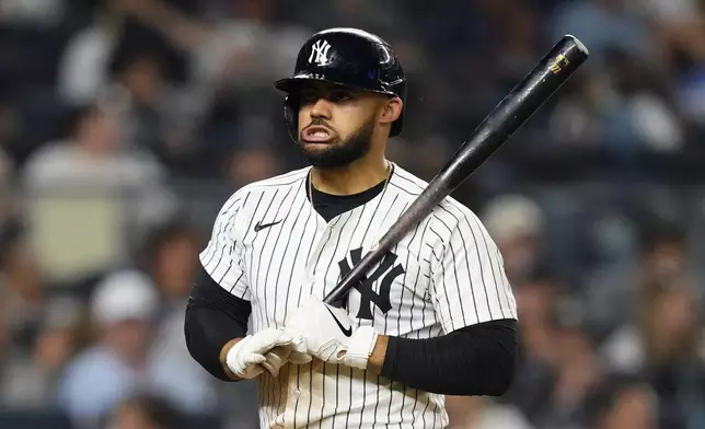New York Yankees' Jasson Domínguez (24) reacts after striking out during the sixth inning of a baseball game against the Seattle Mariners, Thursday, July 10, 2025, in New York. (AP Photo/Yuki Iwamura)
