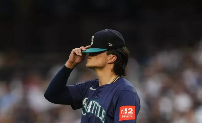 Seattle Mariners pitcher Bryan Woo (22) gets ready to pitch during the first inning of a baseball game against the New York Yankees, Thursday, July 10, 2025, in New York. (AP Photo/Yuki Iwamura)