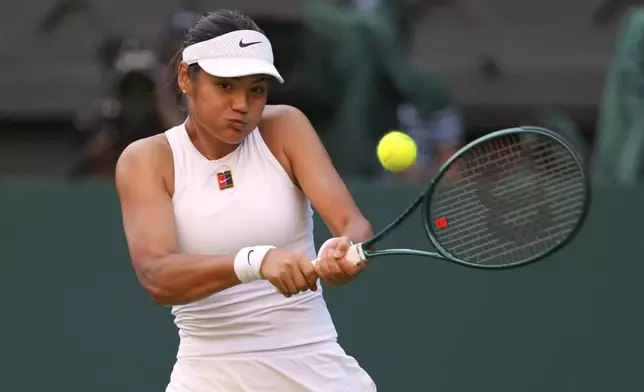 Emma Raducanu of Britain plays a return to Marketa Vondrousova of the Czech Republic during their second round women's singles match at the Wimbledon Tennis Championships in London, Wednesday, July 2, 2025.(AP Photo/Kirsty Wigglesworth)