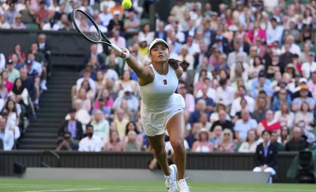 Emma Raducanu of Britain plays a return to Marketa Vondrousova of the Czech Republic during their second round women's singles match at the Wimbledon Tennis Championships in London, Wednesday, July 2, 2025.(AP Photo/Kirsty Wigglesworth)