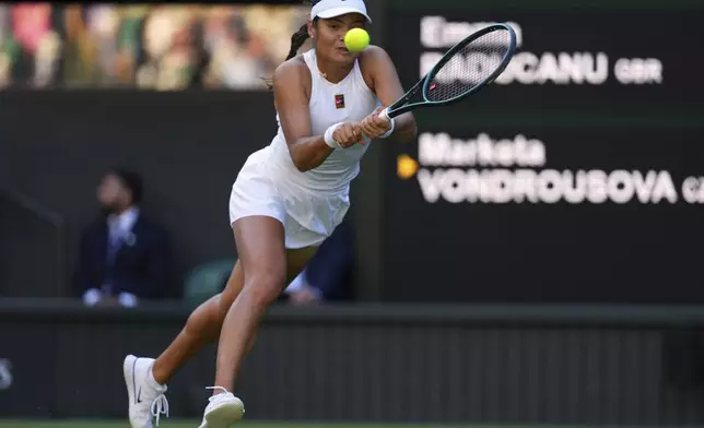 Emma Raducanu of Britain plays a return to Marketa Vondrousova of the Czech Republic during their second round women's singles match at the Wimbledon Tennis Championships in London, Wednesday, July 2, 2025.(AP Photo/Kirsty Wigglesworth)
