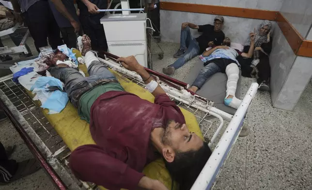 Wounded Palestinians are brought to Shifa Hospital in Gaza City after being injured while on their way to an aid distribution center, Thursday, July 3, 2025. (AP Photo/Jehad Alshrafi)