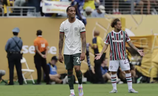 Chelsea's Joao Pedro reacts after scoring his side's opening goal during the Club World Cup semifinal soccer match between Fluminense and Chelsea in East Rutherford, N.J., Tuesday, July 8, 2025. (AP Photo/Adam Hunger)