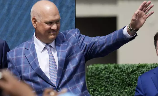 FILE - Former Chicago Cubs player Ryne Sandberg waves before the team unveils a statue of him before a baseball game against the New York Mets in Chicago, June 23, 2024. (AP Photo/Nam Y. Huh, File)