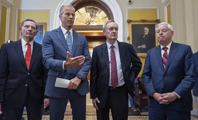 Senate Majority Leader John Thune, R-S.D., center, joined from left by, Sen. John Barrasso, R-Wyo., the GOP whip, Finance Committee Chairman Mike Crapo, R-Idaho, and Budget Committee Chairman Lindsey Graham, R-S.C., speaks to reporters after passage of the budget reconciliation package of President Donald Trump's signature bill of big tax breaks and spending cuts, at the Capitol in Washington, Tuesday, July 1, 2025. (AP Photo/J. Scott Applewhite)