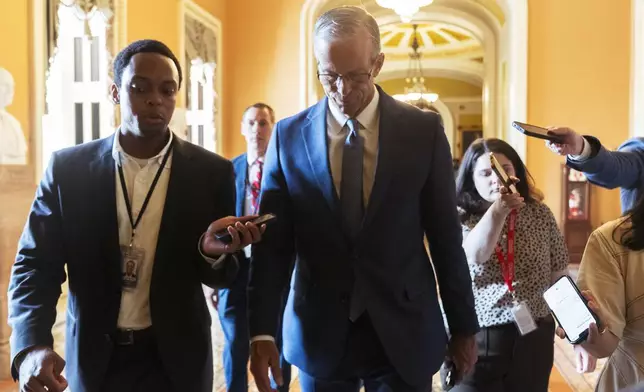 Senate Majority Leader John Thune, R-S.D., is followed by reporters as he walks from the chamber to his office as Republicans begin a final push to advance President Donald Trump's tax breaks and spending cuts package, at the Capitol in Washington, Monday, June 30, 2025. (AP Photo/Manuel Balce Ceneta)