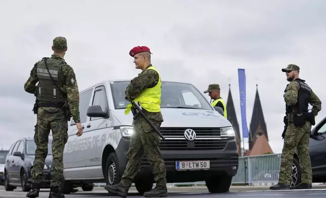 Polish border police check vehicles at a checkpoint bordering Germany, in Slubice, Poland, Monday, July 7, 2025. (AP Photo/Ebrahim Noroozi)